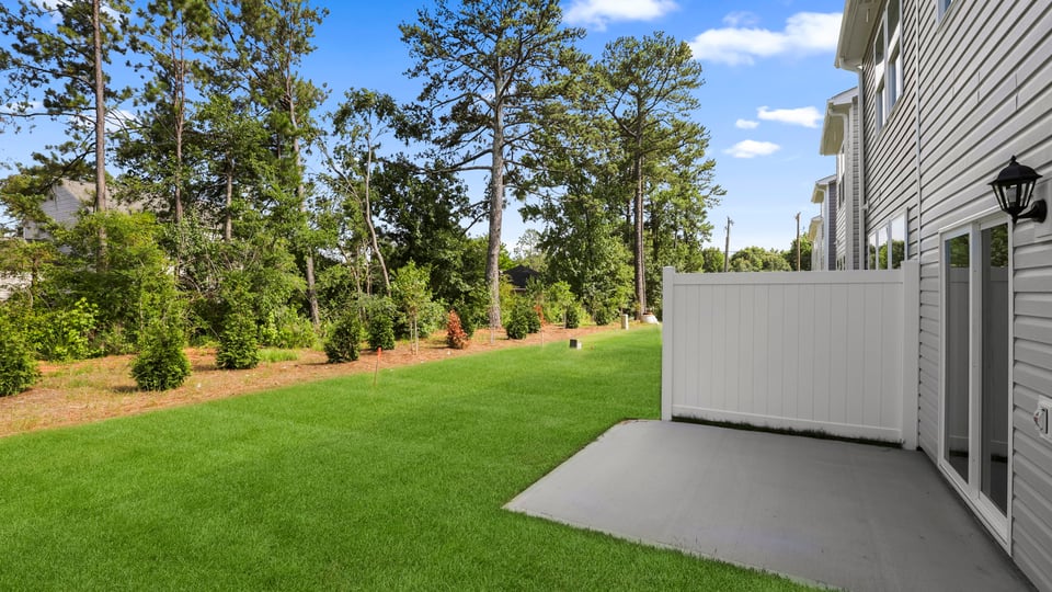 Back exterior with large backyard.