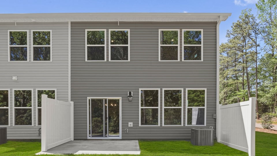 Back exterior with large backyard.