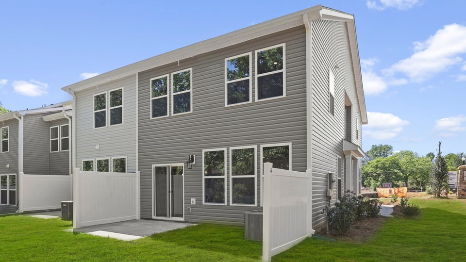 Back exterior with large backyard.