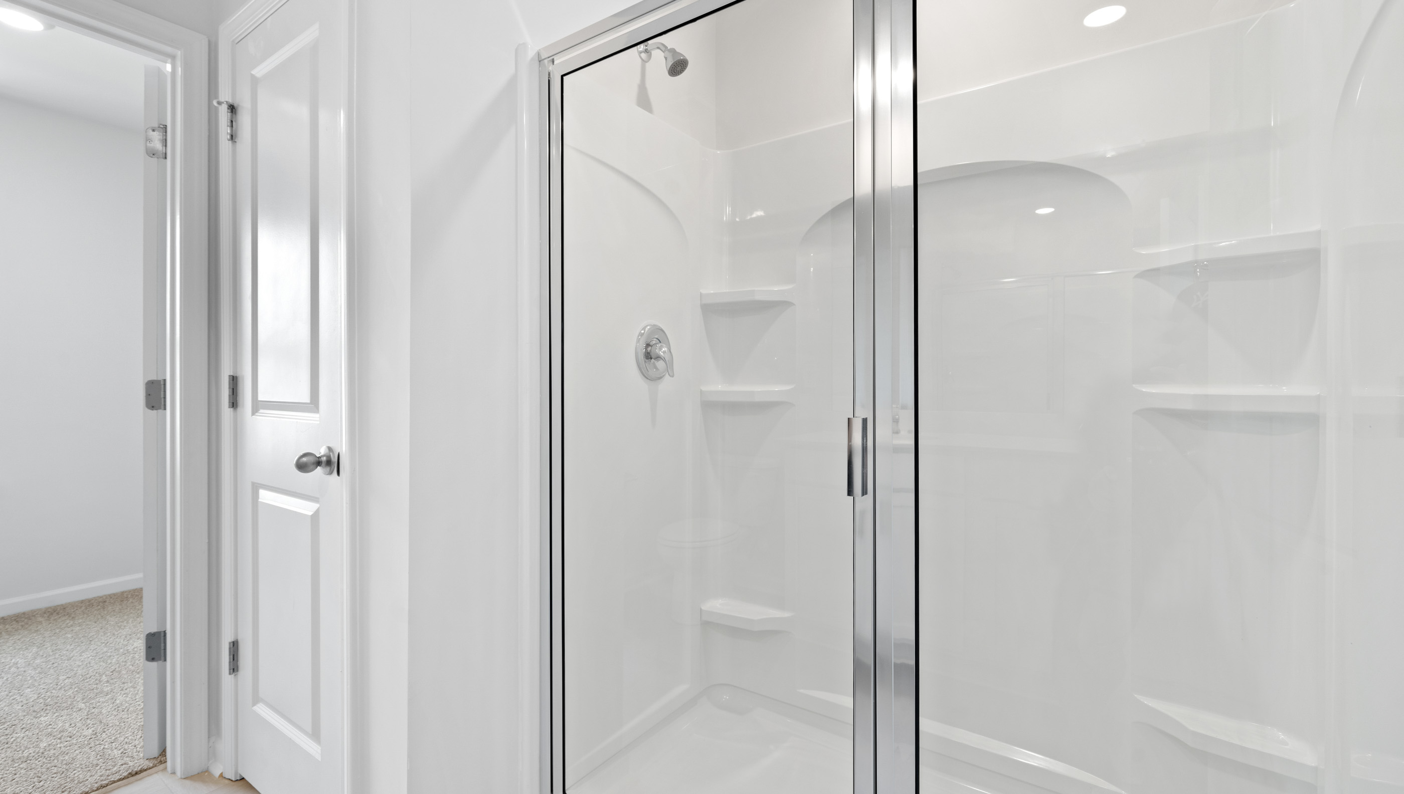 Bathroom with walk in shower.