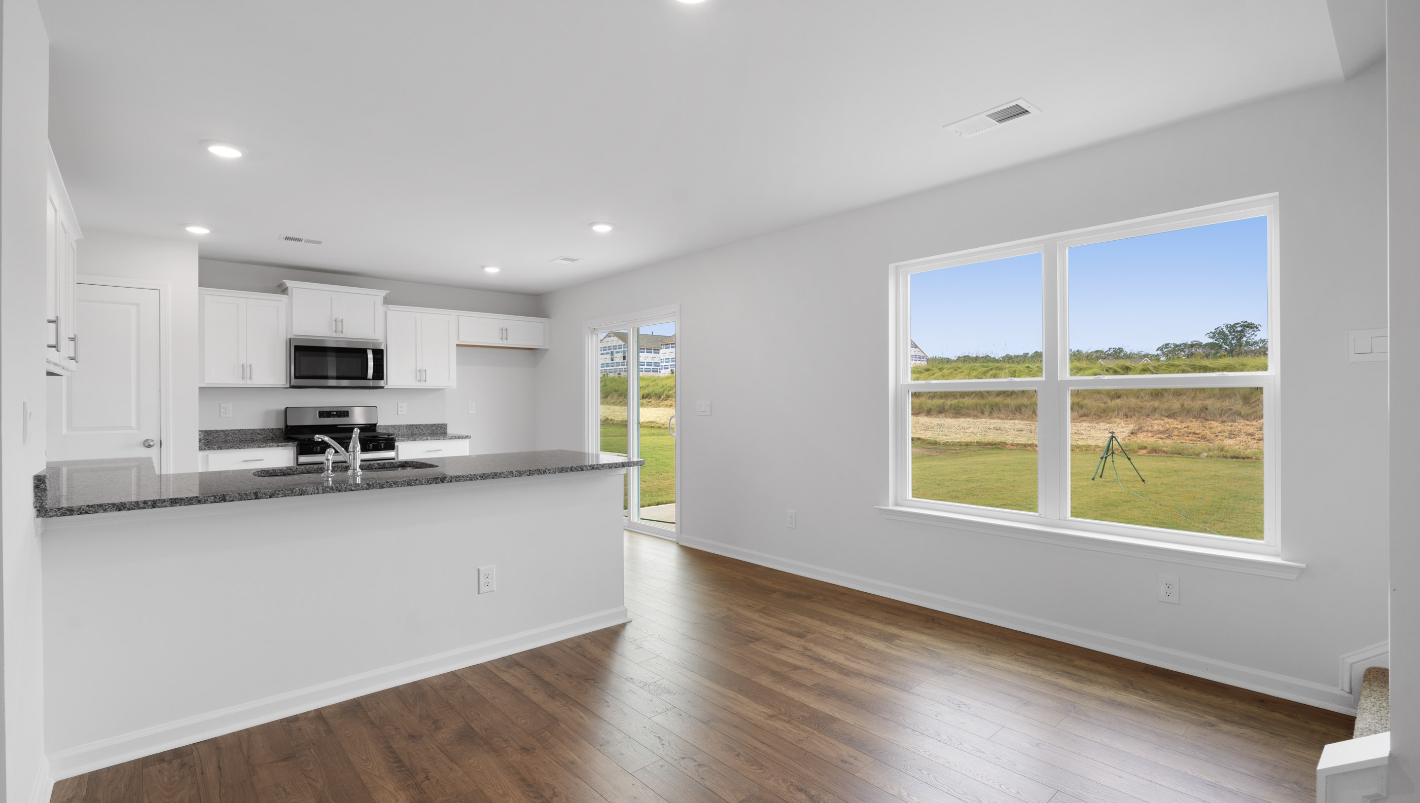 View of kitchen with windows.