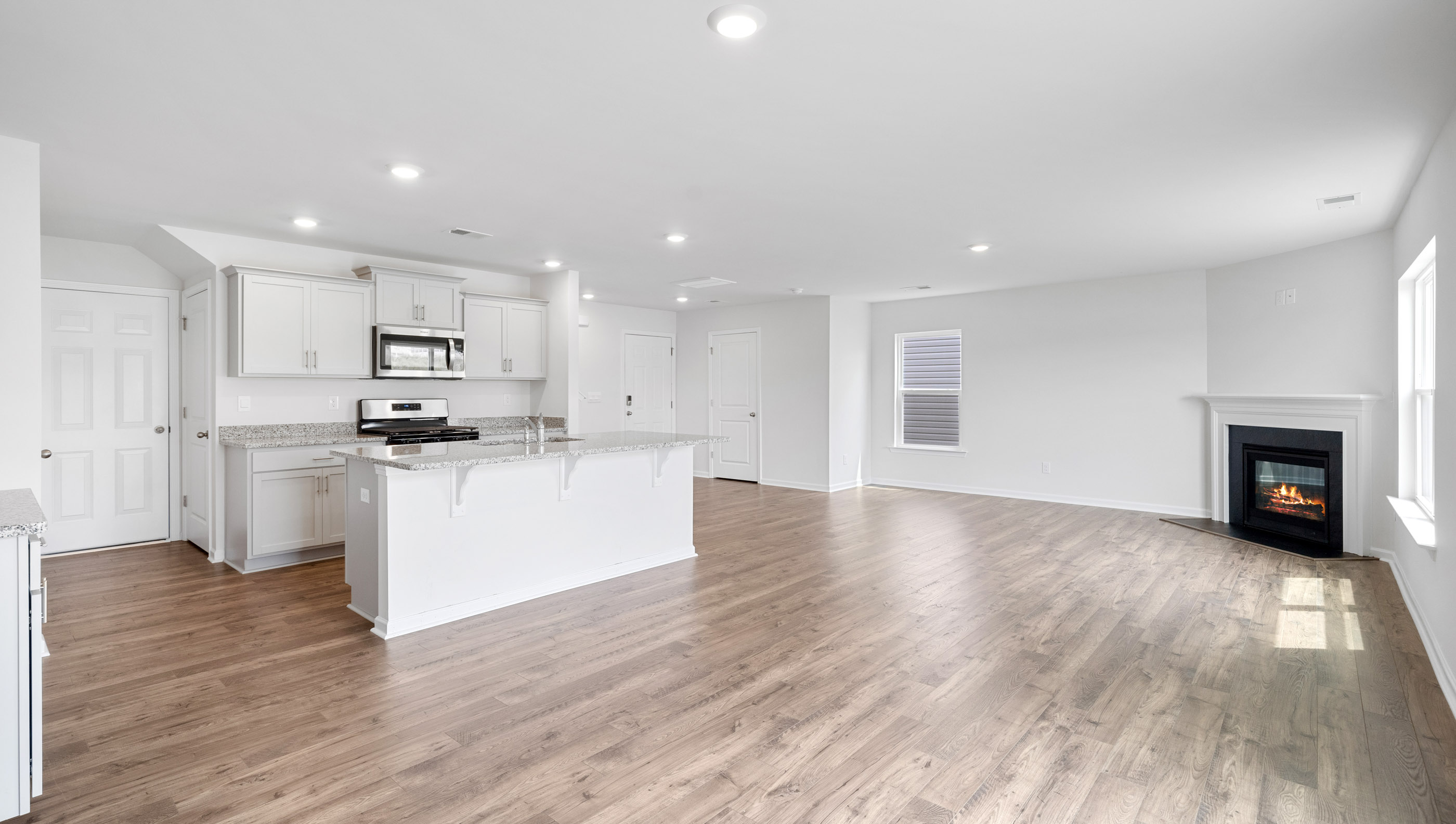 Family room and view of kitchen.