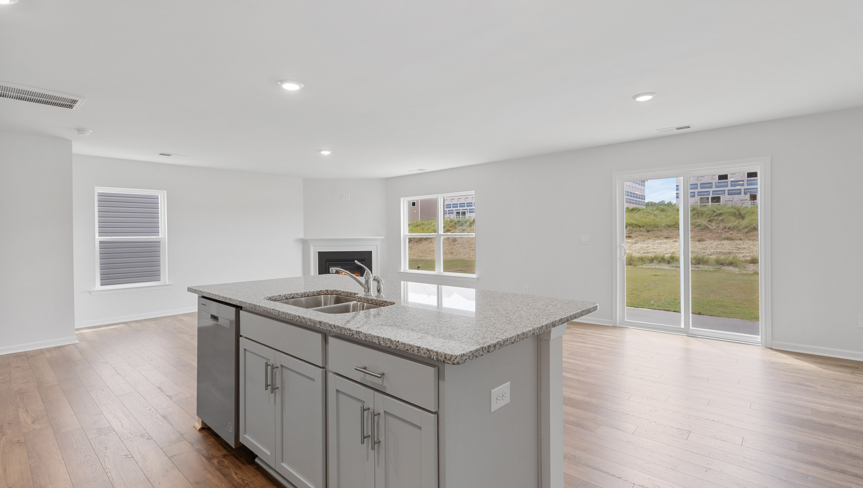 Kitchen and island with granite counter tops.