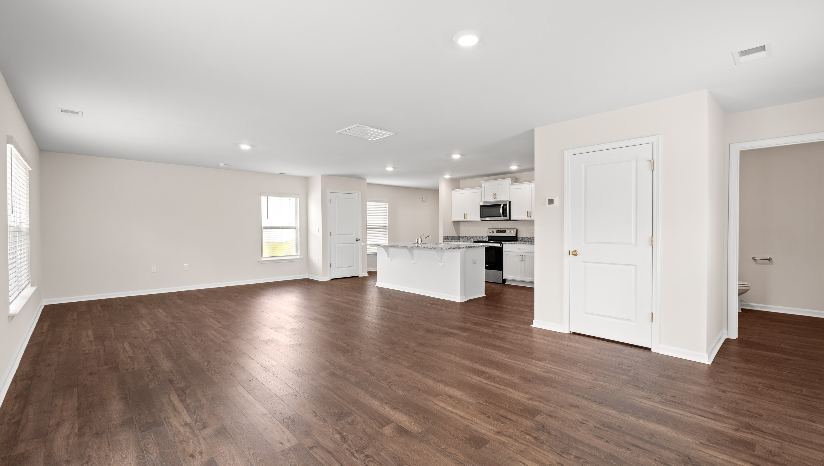 Family room with view of kitchen.