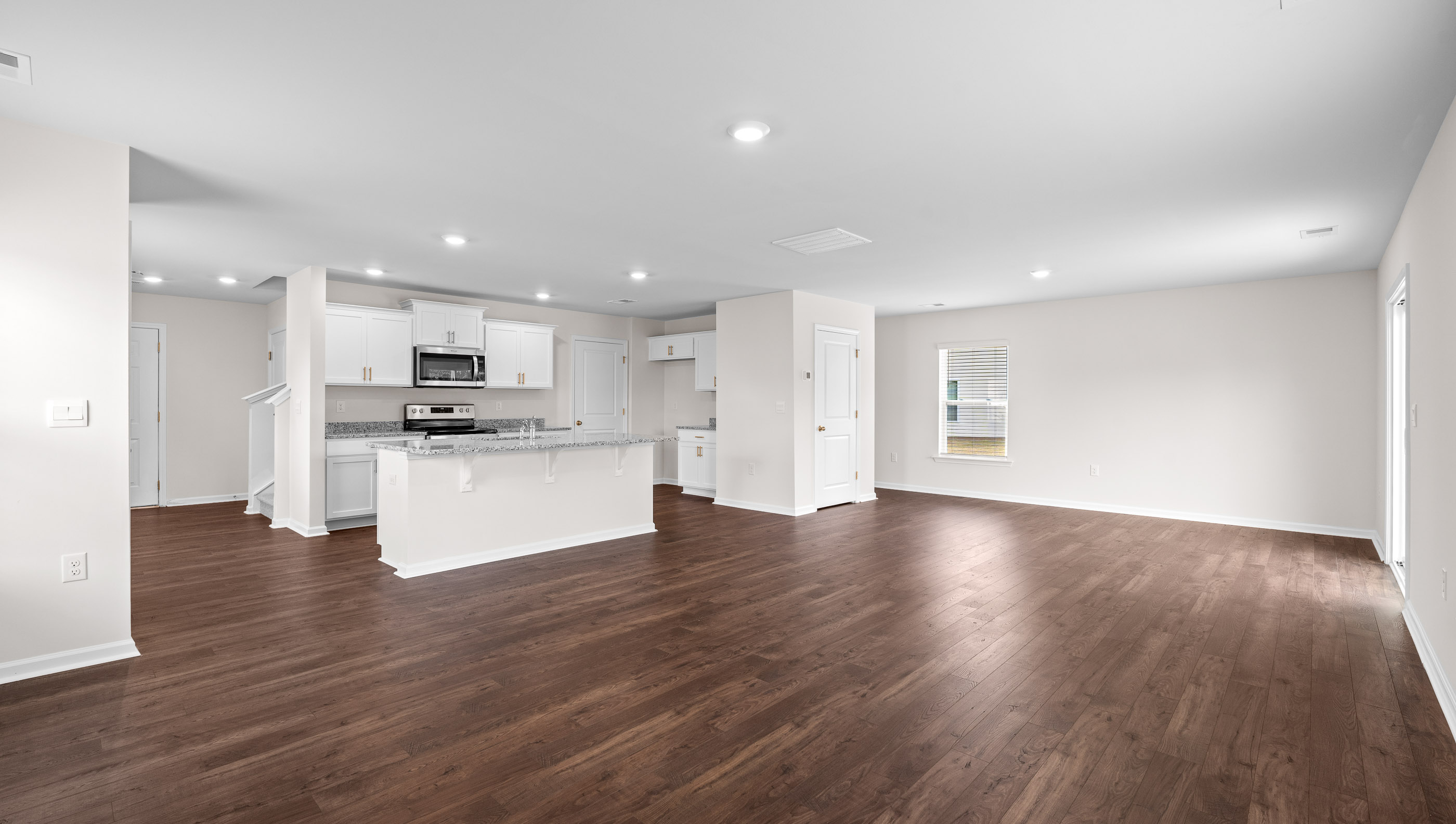 Family room with view of kitchen,
