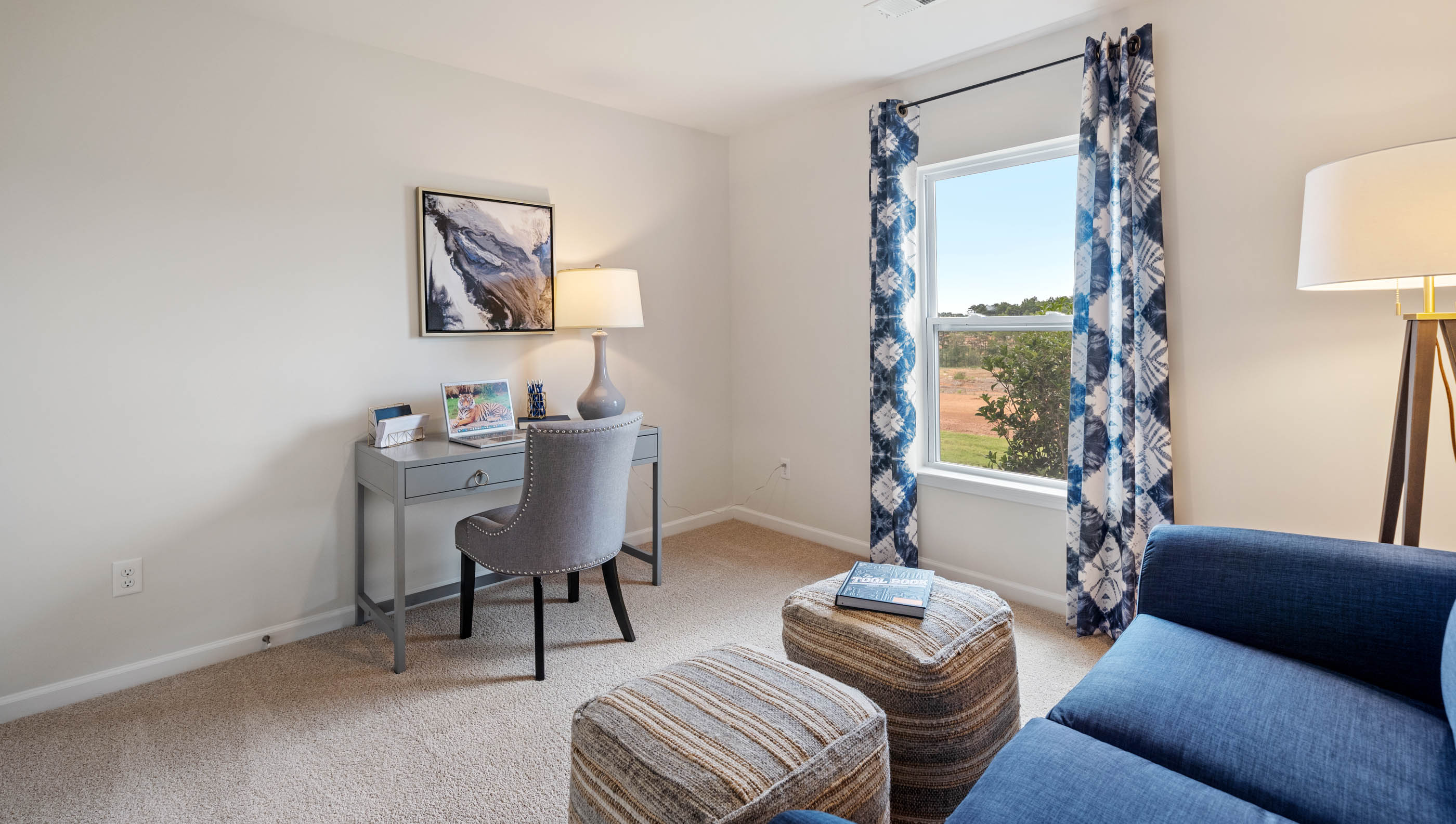 Bedroom with carpet and window.