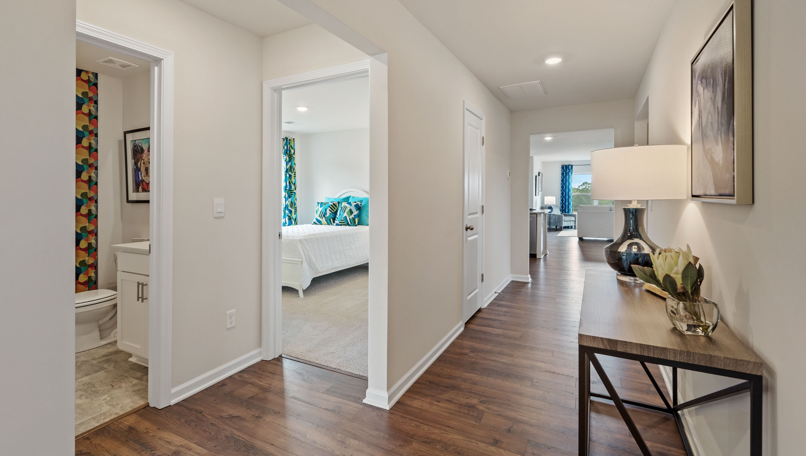 Hallway into home with view of rooms.