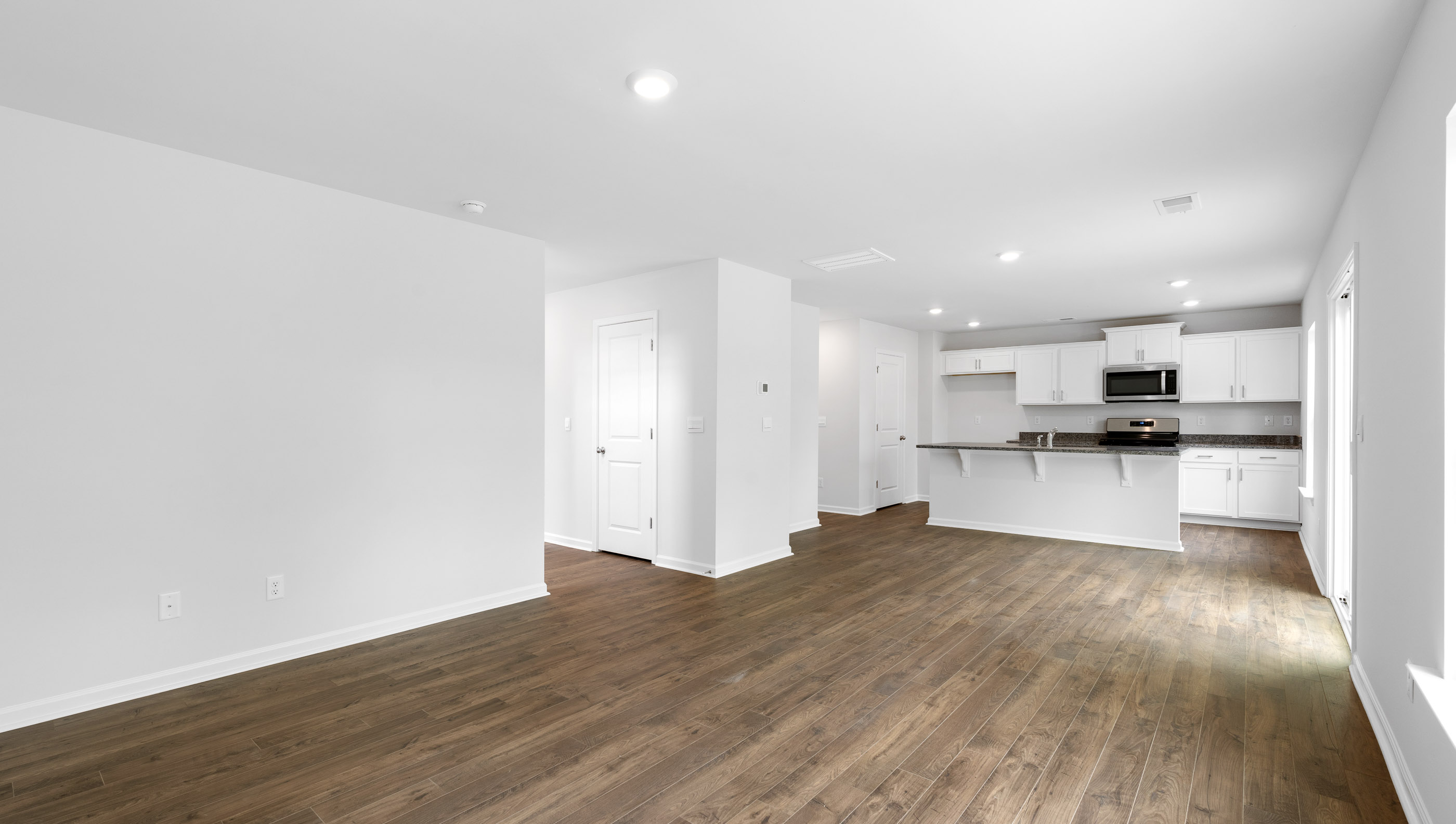 Family room with view of kitchen.