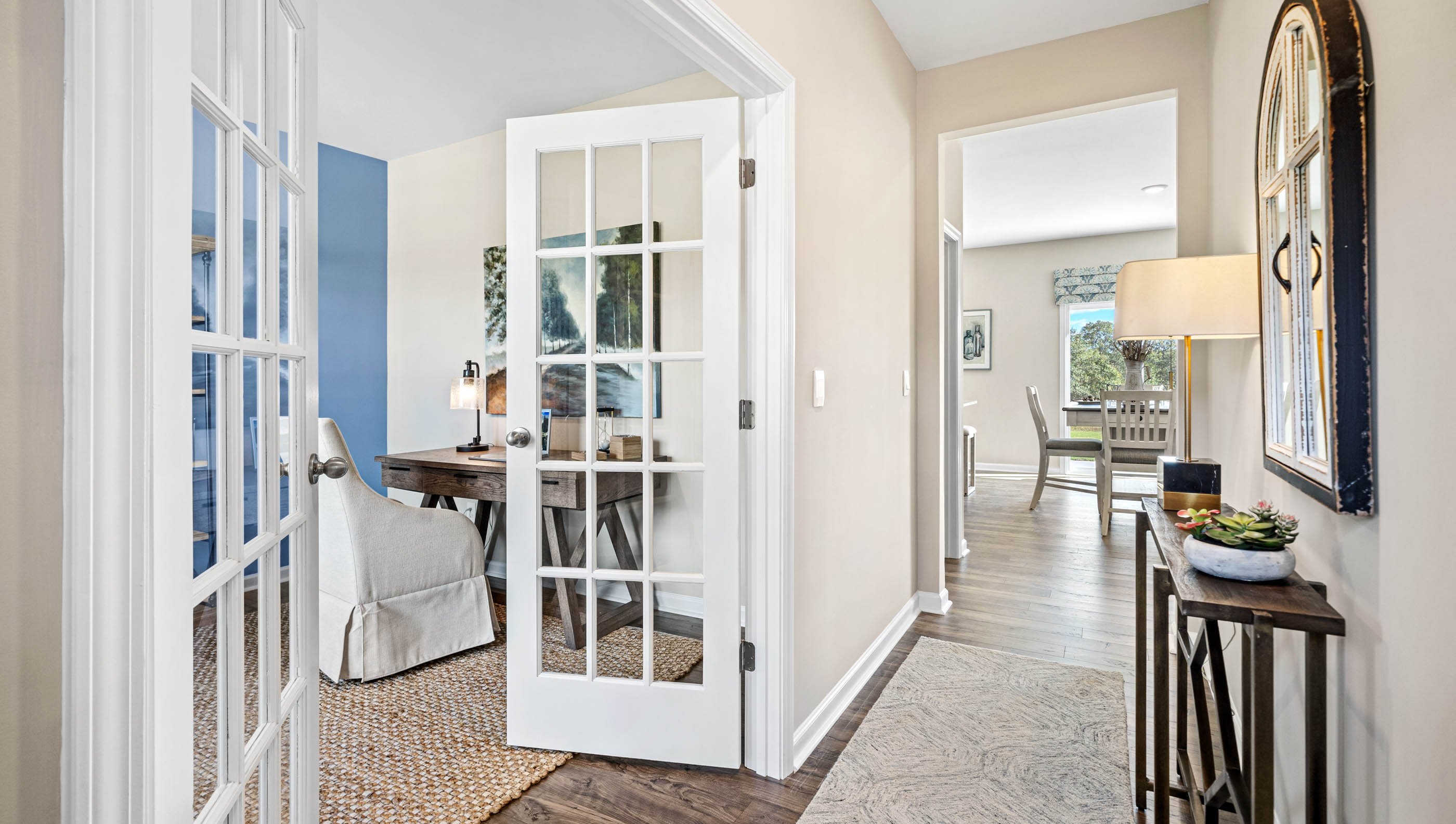 Halwlay into home with view of flex room.