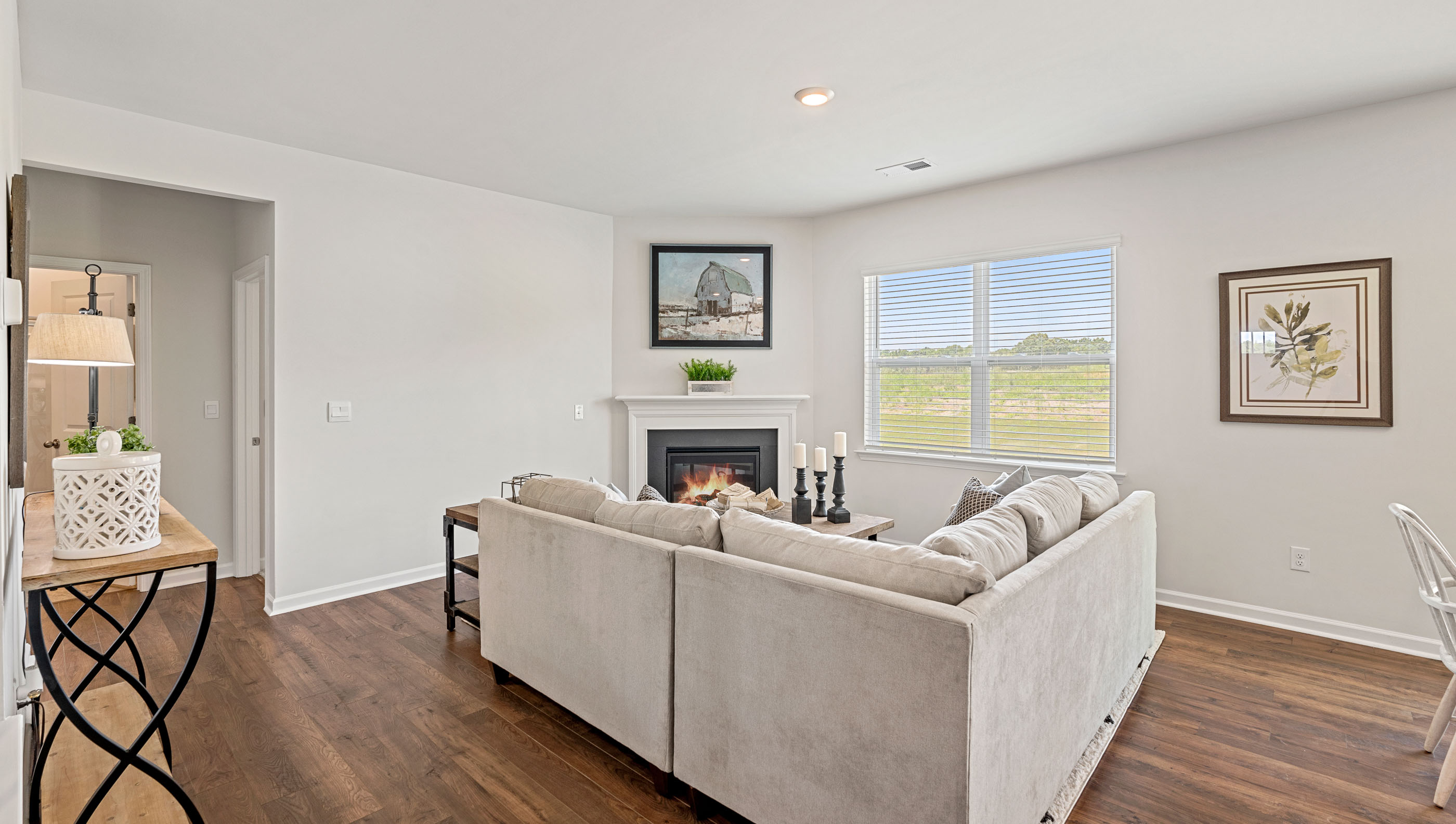 Family room with fireplace and windows.
