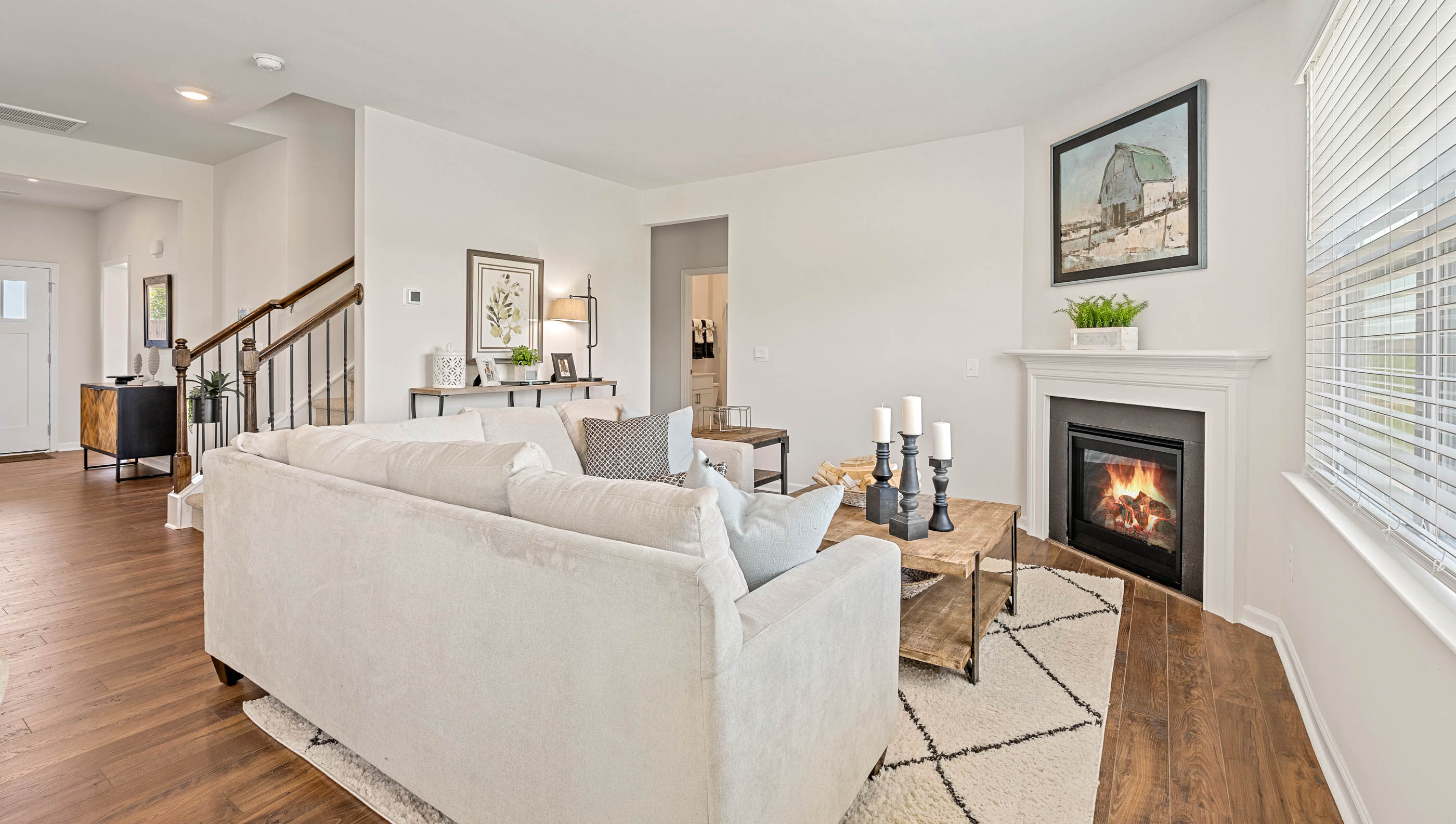 Family room with fireplace and windows.