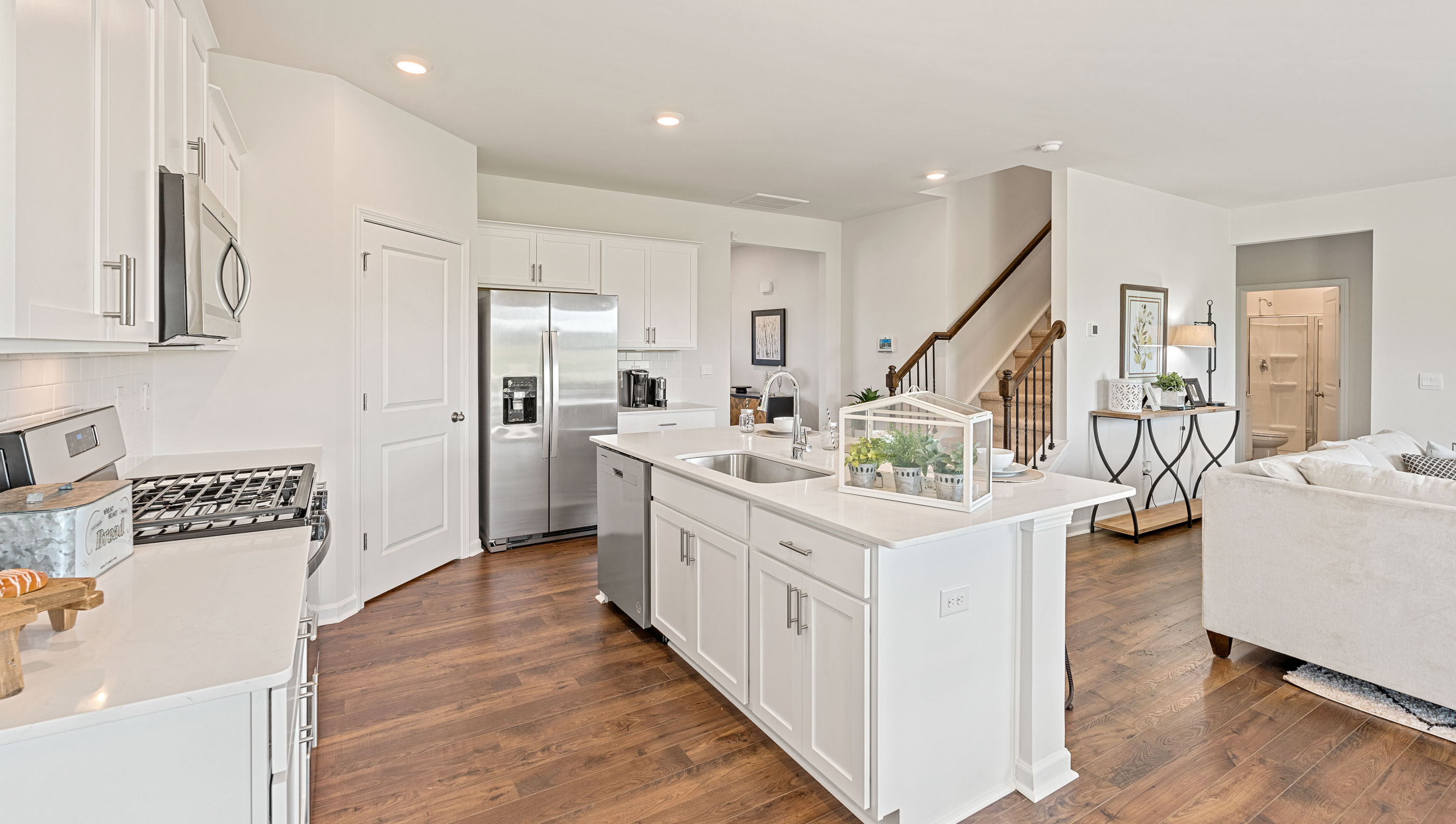 Kitchen and island with granite counter tops.