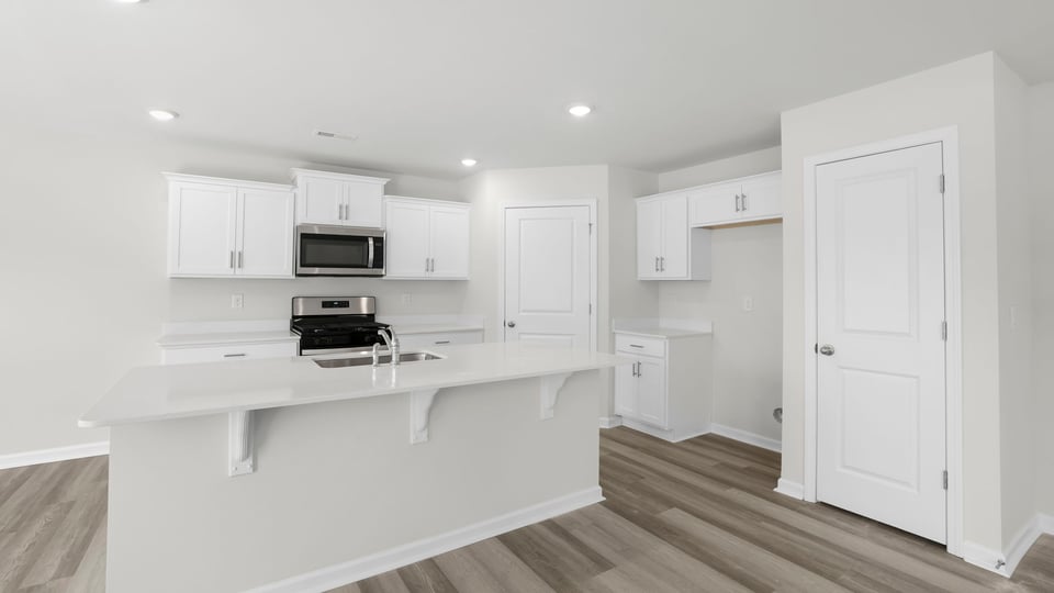 Kitchen with island and countertops.