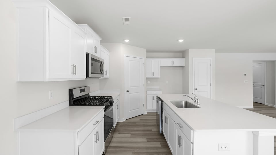 Kitchen with island and countertops.
