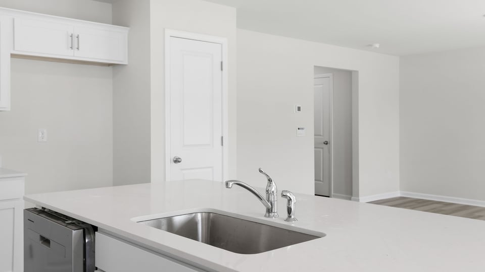 Kitchen with island and countertops.