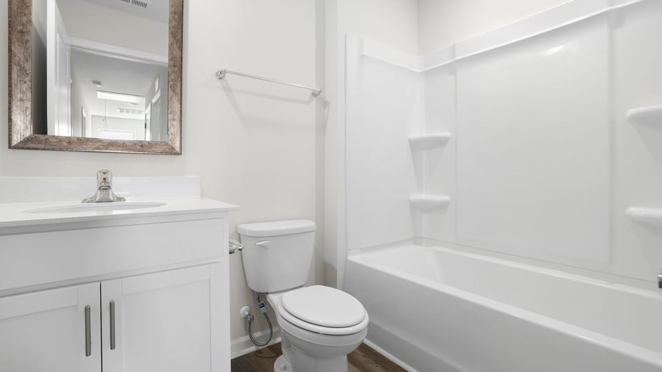 Bathroom with vanity and tub.