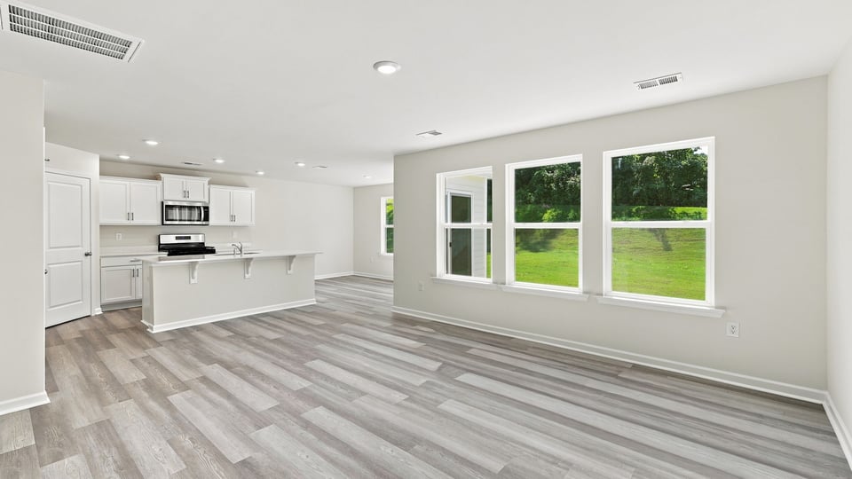View of combination living and dining areas.