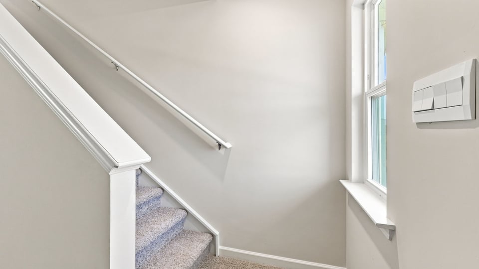 View of stairwell to the upper level.