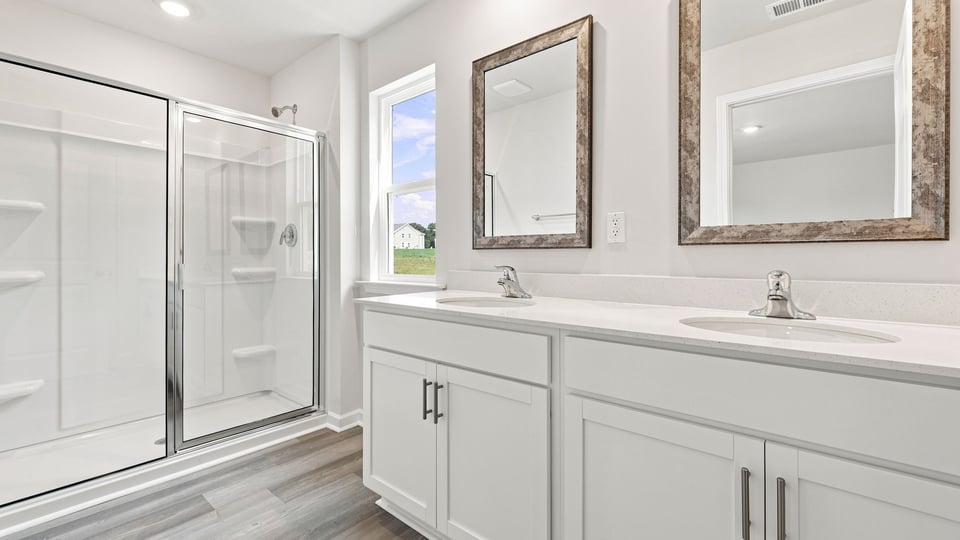 Primary bathroom with dual sink vanity.