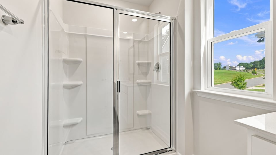Primary bathroom walk-in shower.