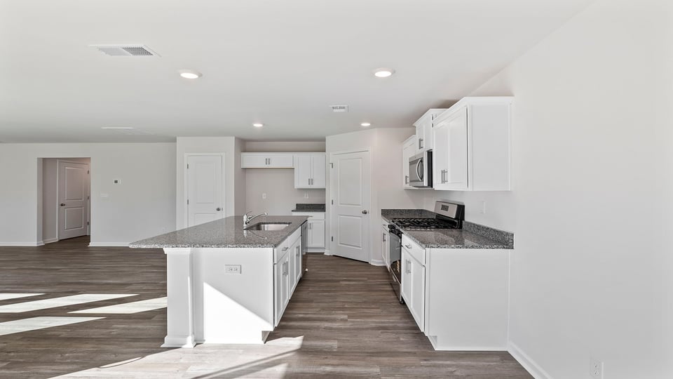 Kitchen with island and countertops.