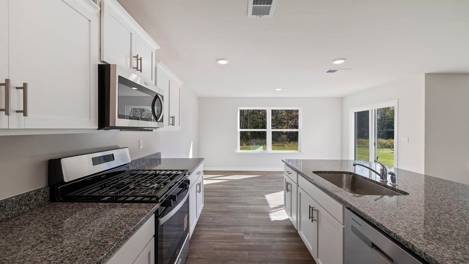 Kitchen with island and countertops.