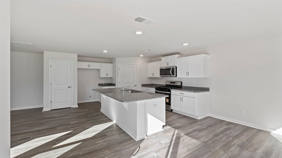 Kitchen with island and countertops.