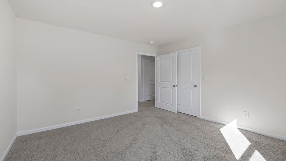Bedroom with carpet.