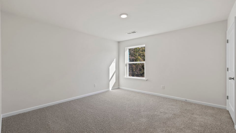 Bedroom with carpet.
