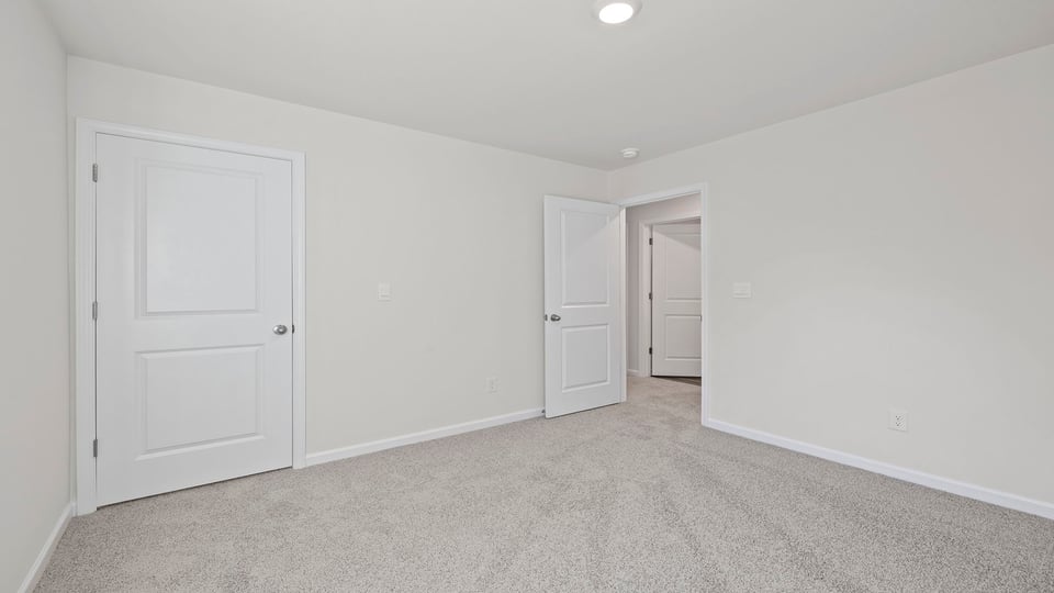 Bedroom with carpet.