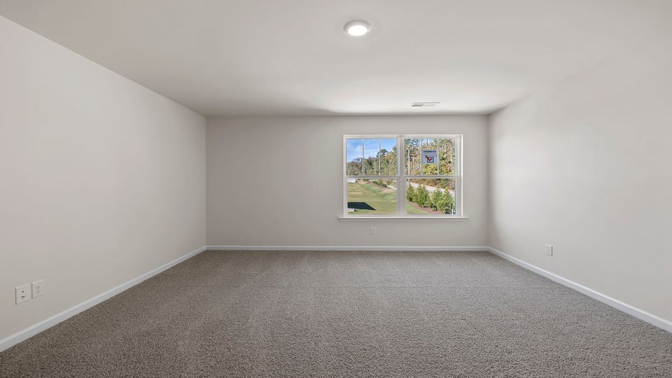 Bedroom with carpet.