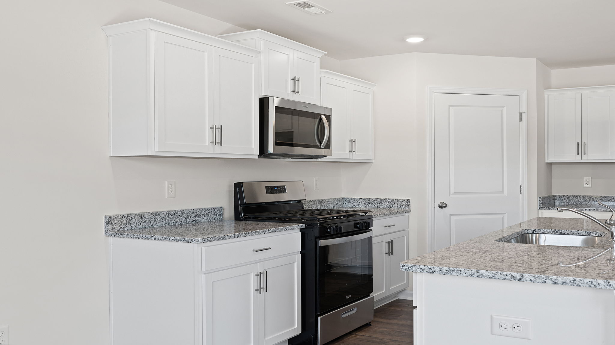 Kitchen with granite countertops.