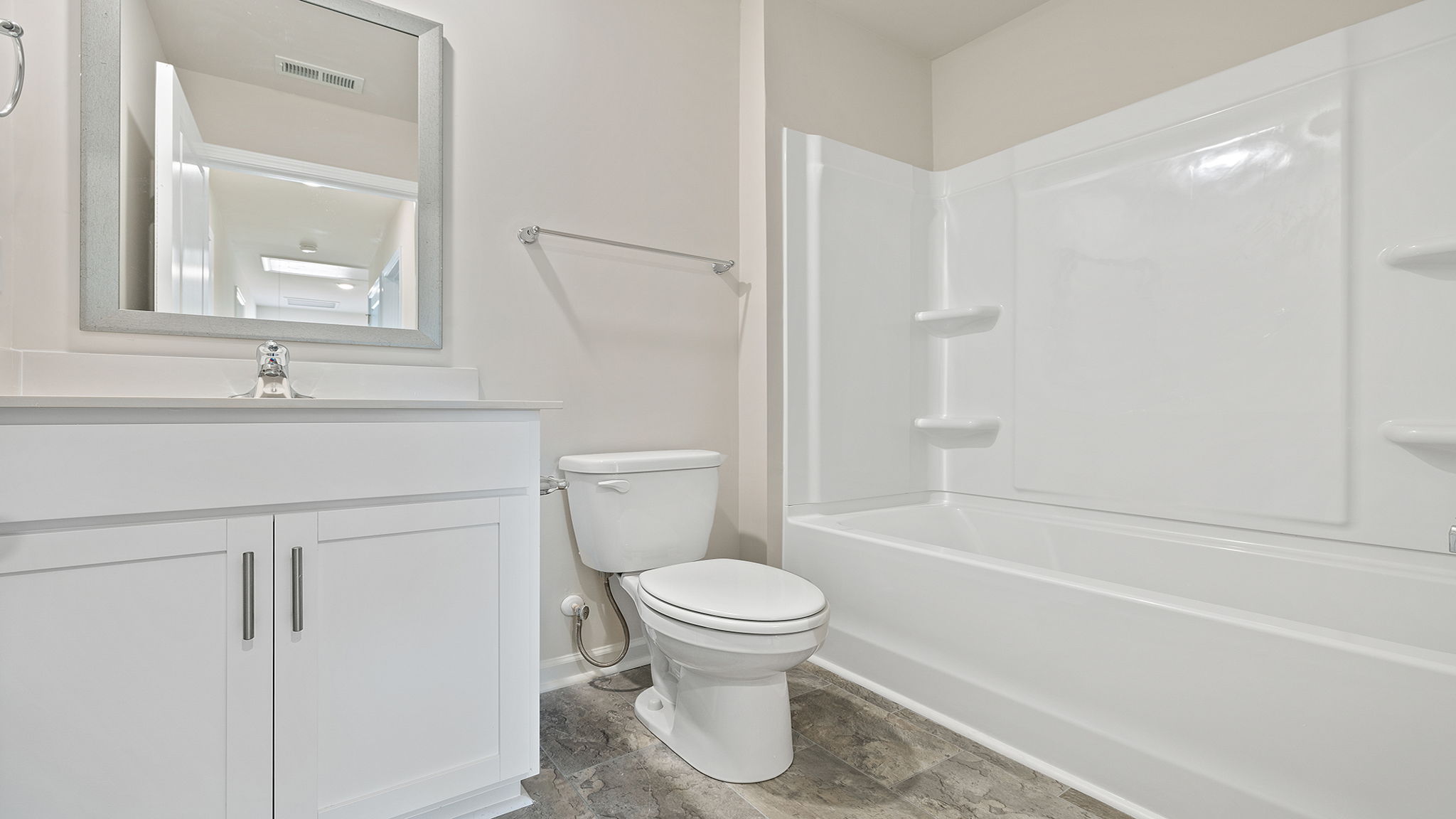 Bathroom with vanity and tub.