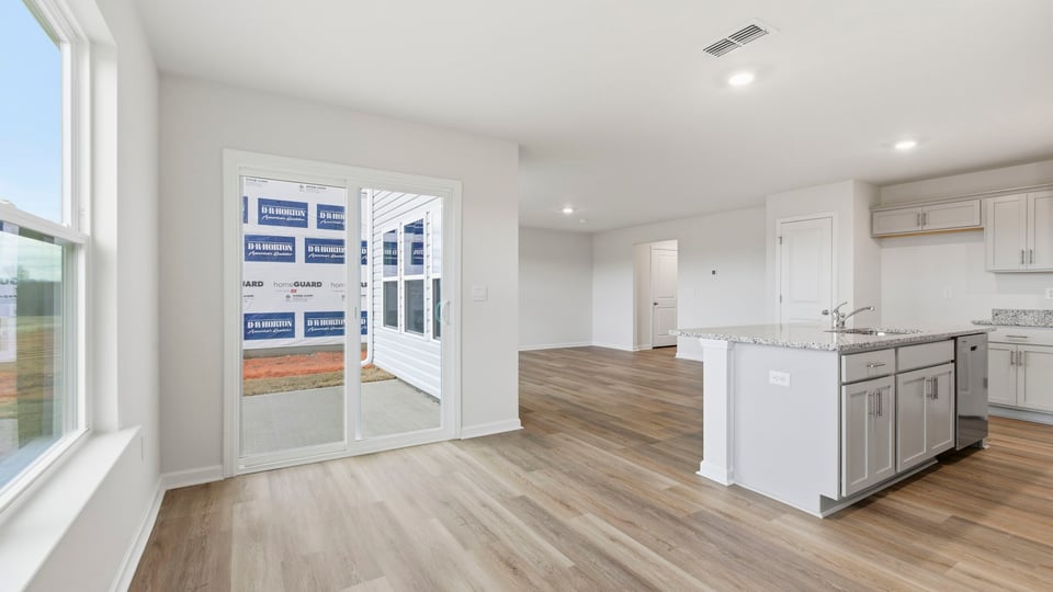 Kitchen and island with granite counter tops.