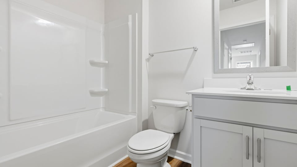 Bathroom with tub and vanity.