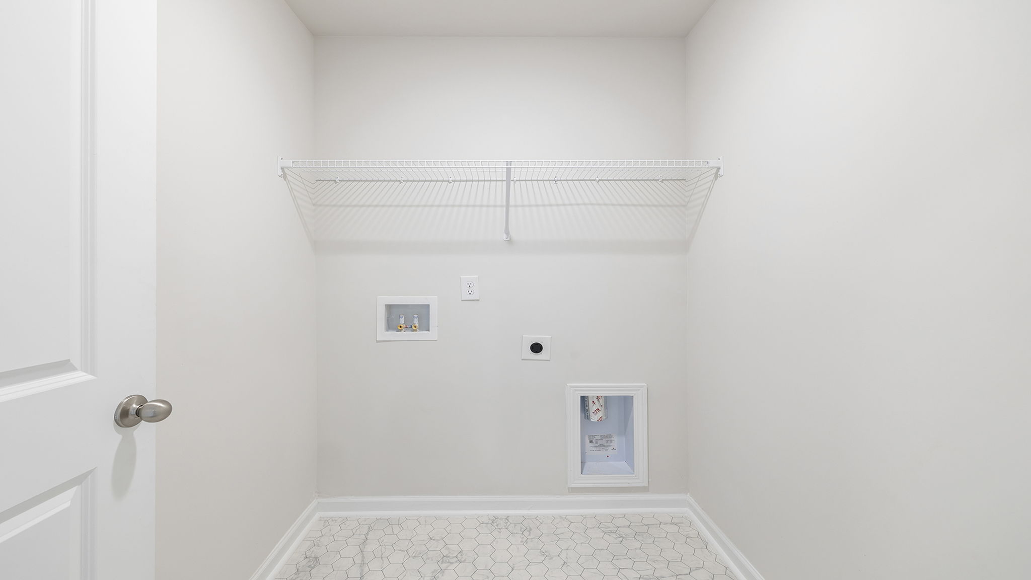 Walk in laundry with shelves.