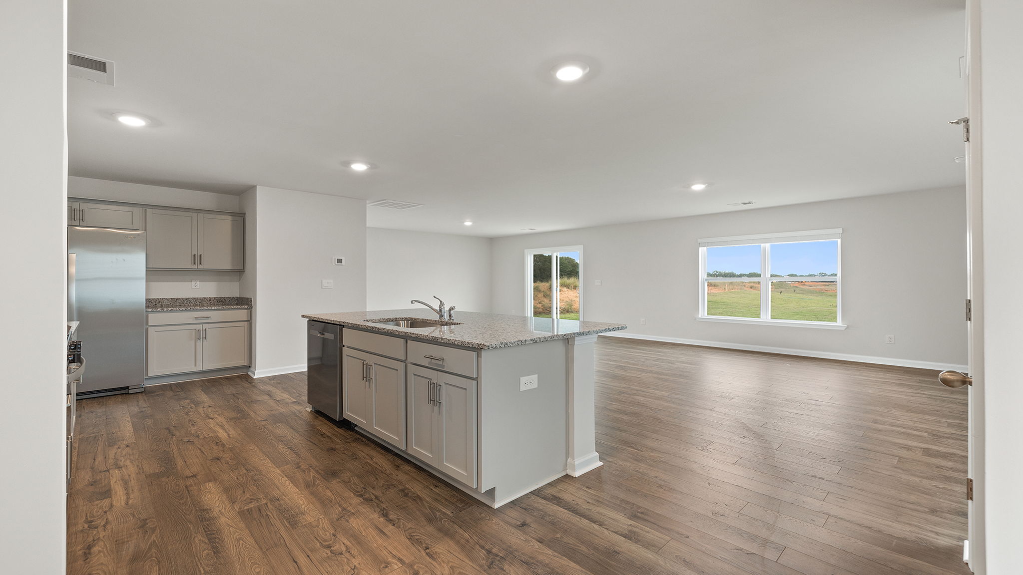 Kitchen with island and countertops.