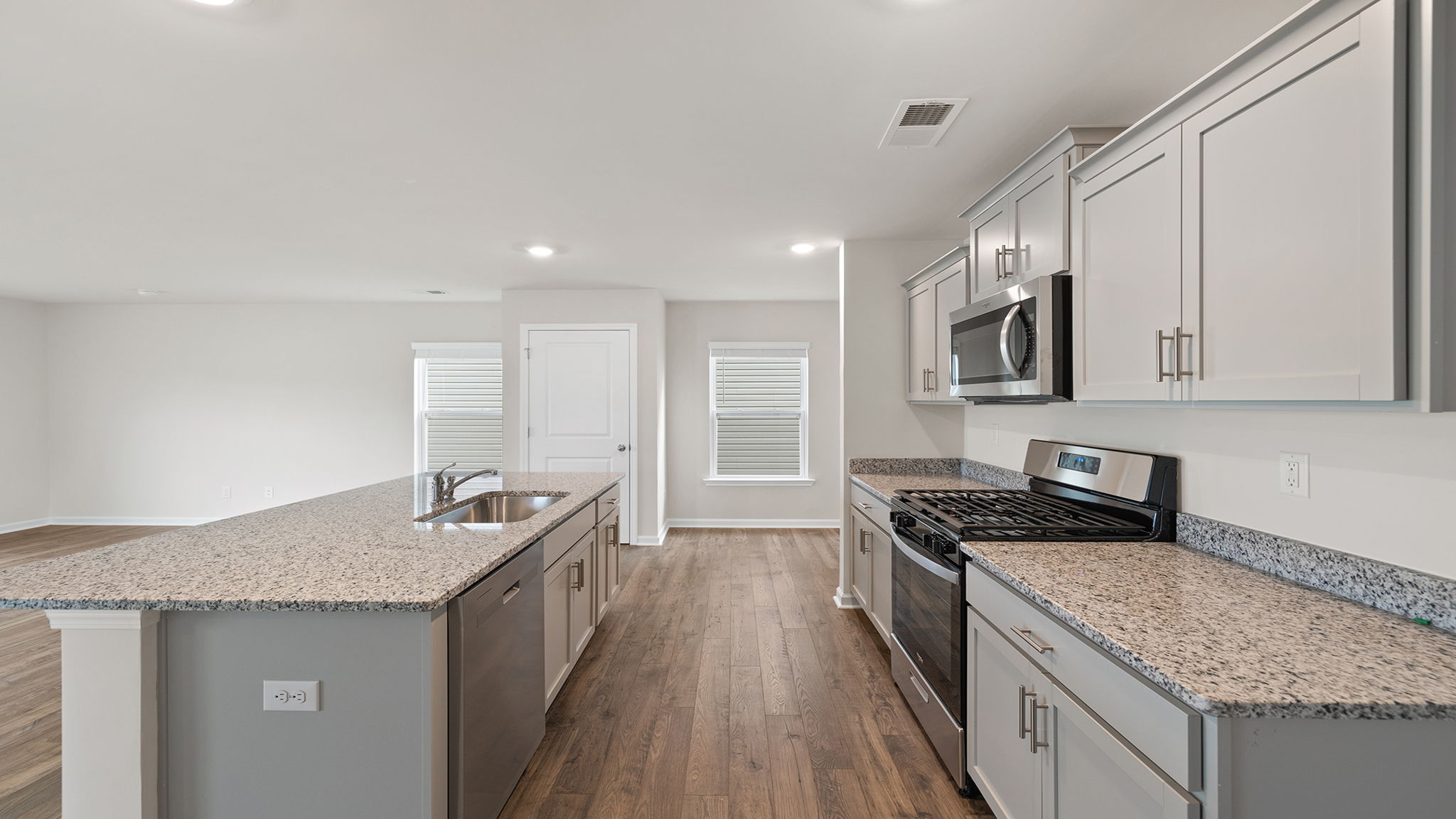 Kitchen with island and countertops.
