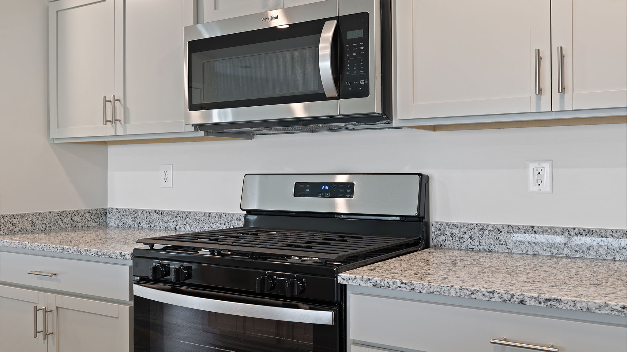 Kitchen with island and countertops.