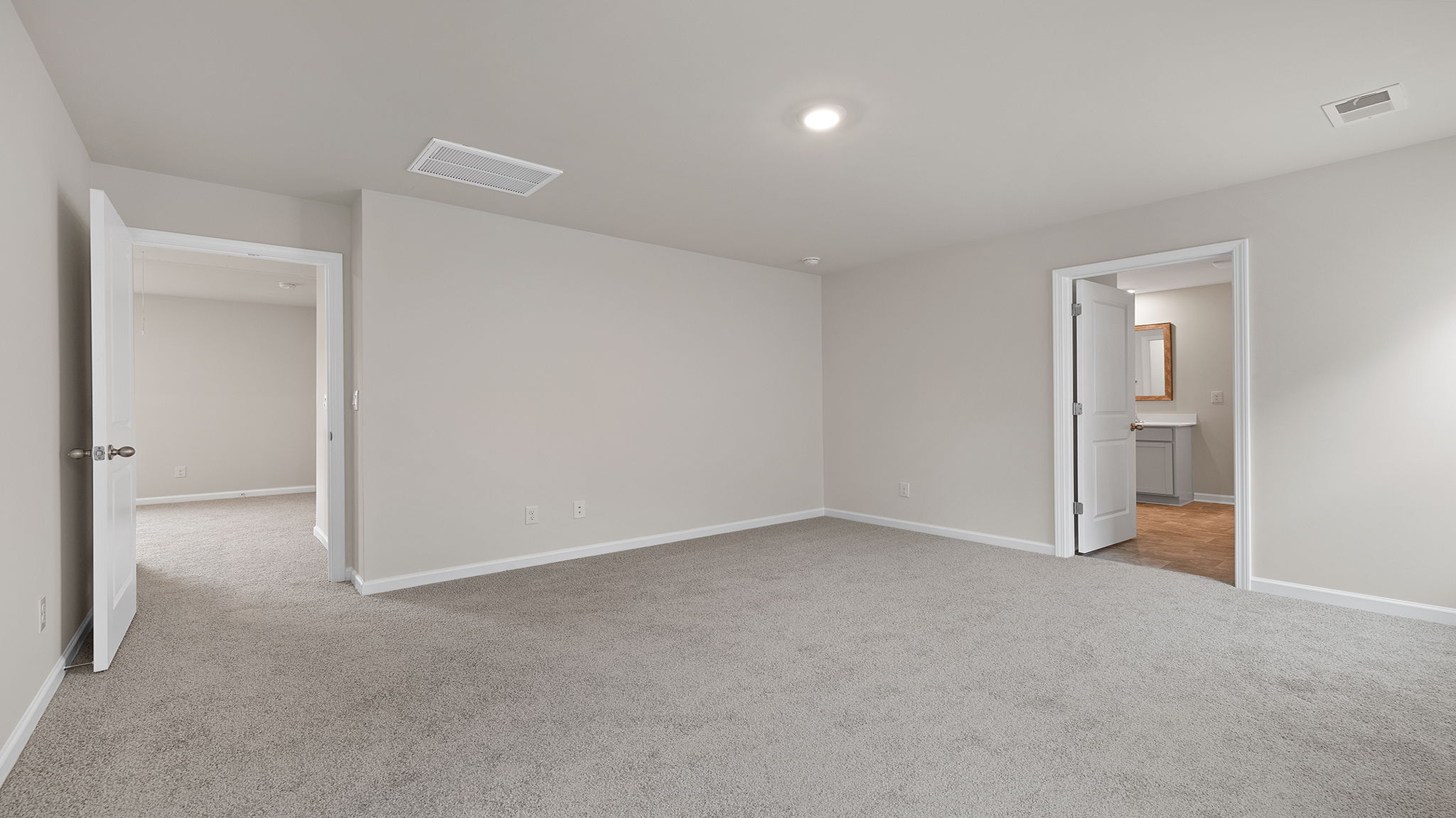 Bedroom with carpet and window.