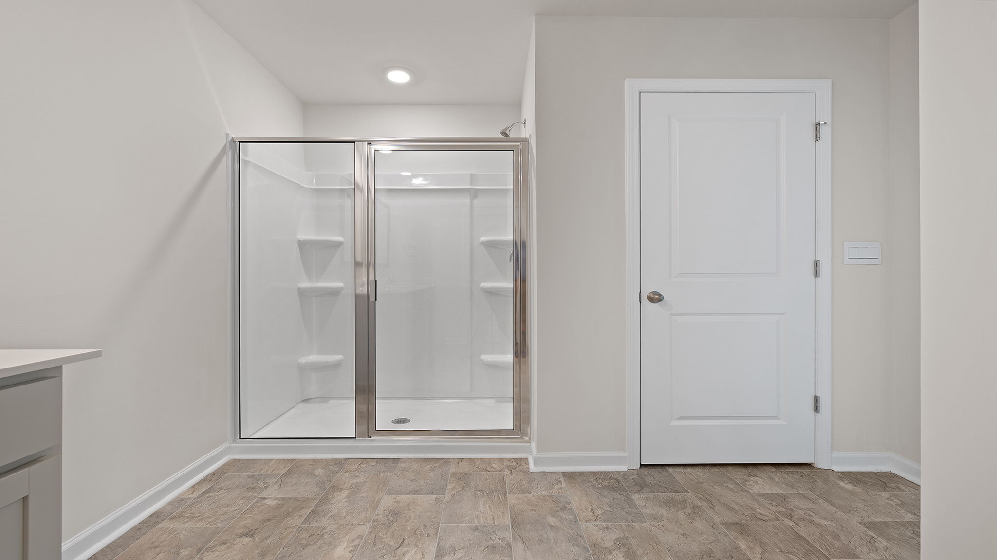 Bathroom with walk in shower.