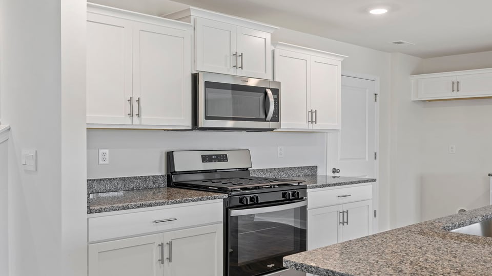 Kitchen with island and countertops.