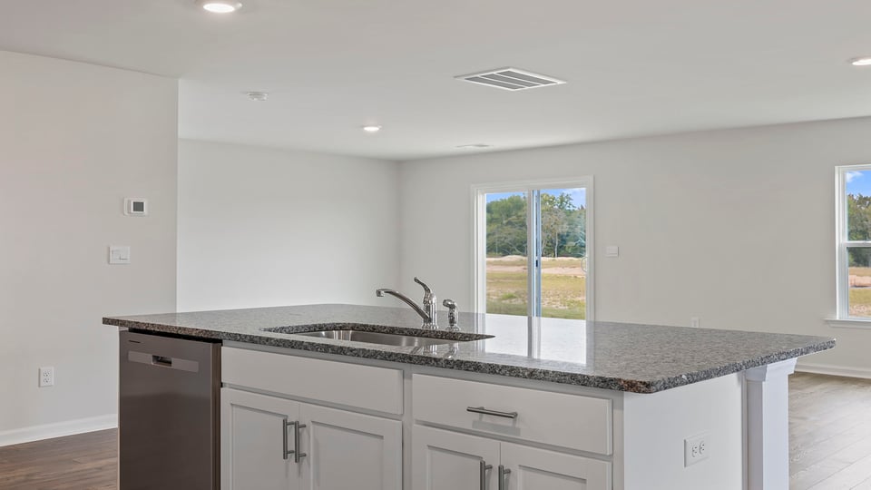 Kitchen with island and countertops.
