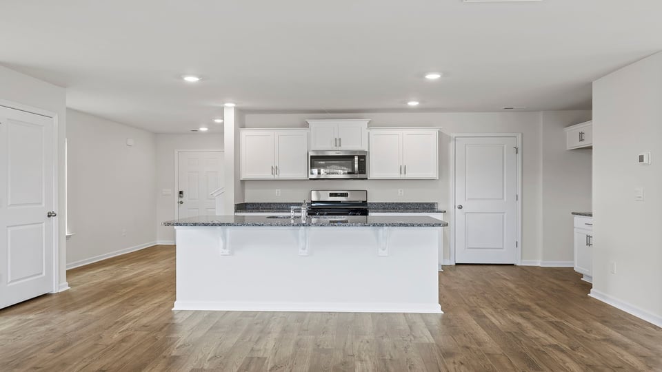 Kitchen with island and countertops.