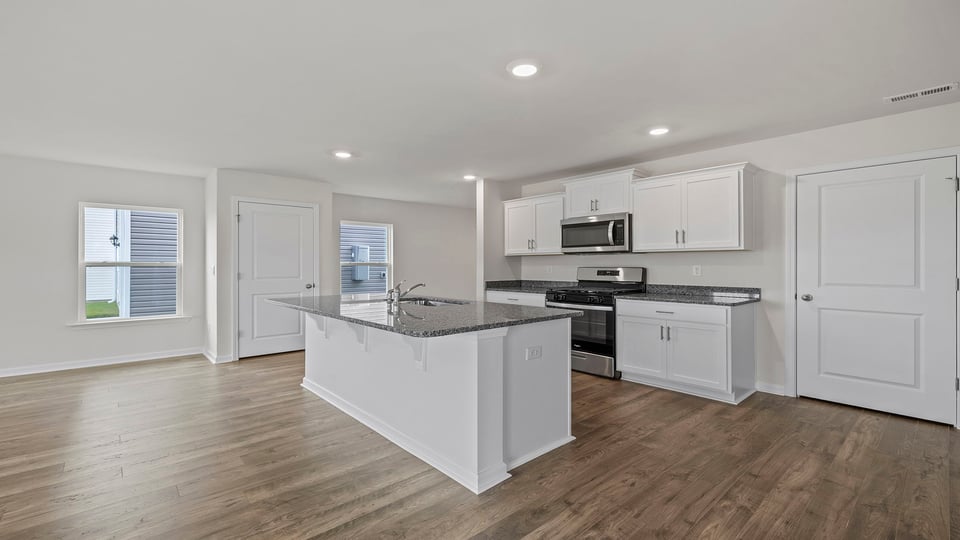Kitchen with island and countertops.