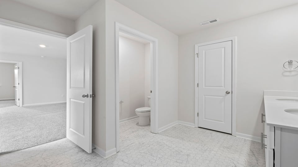 Bathroom with vanity and walk in shower.