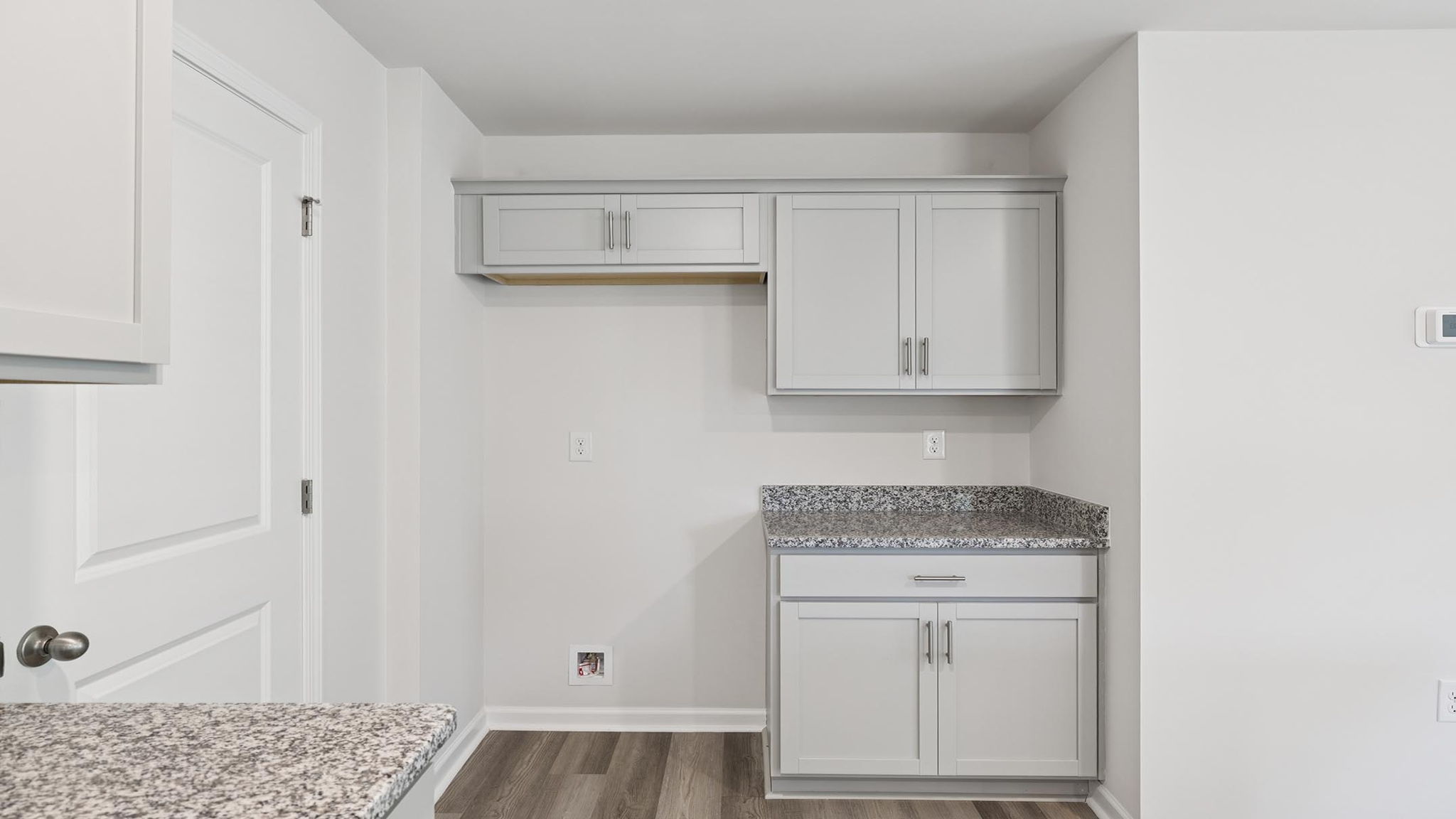 Kitchen and island with granite countertops.