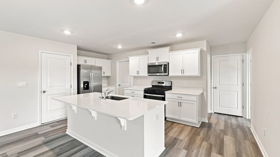 Kitchen with island and countertops.