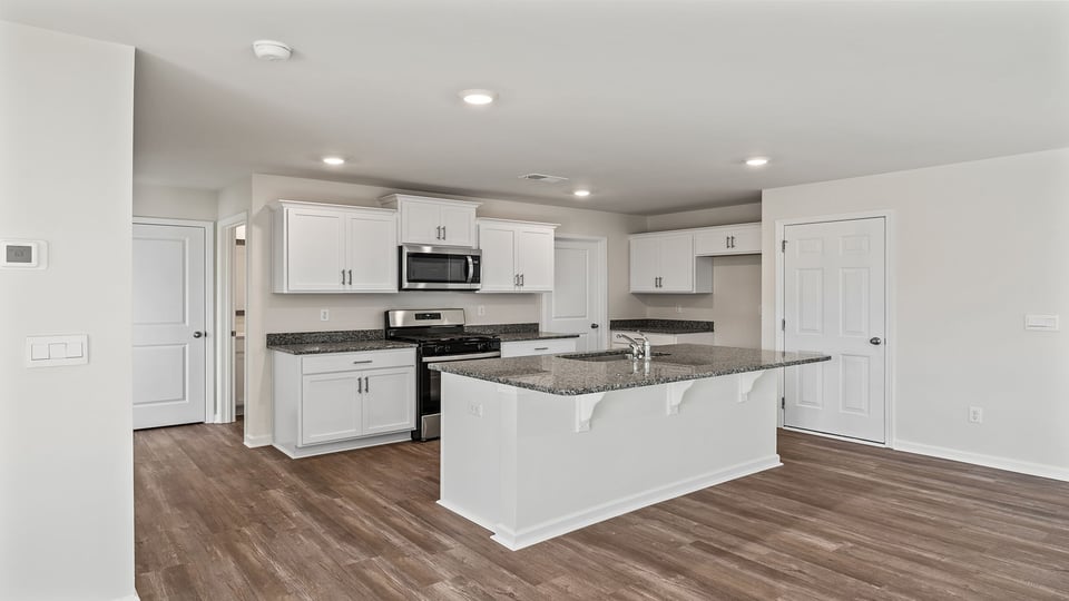 Kitchen with island and countertops.