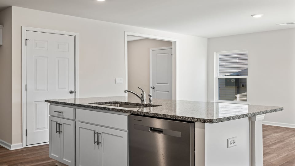 Kitchen with island and countertops.